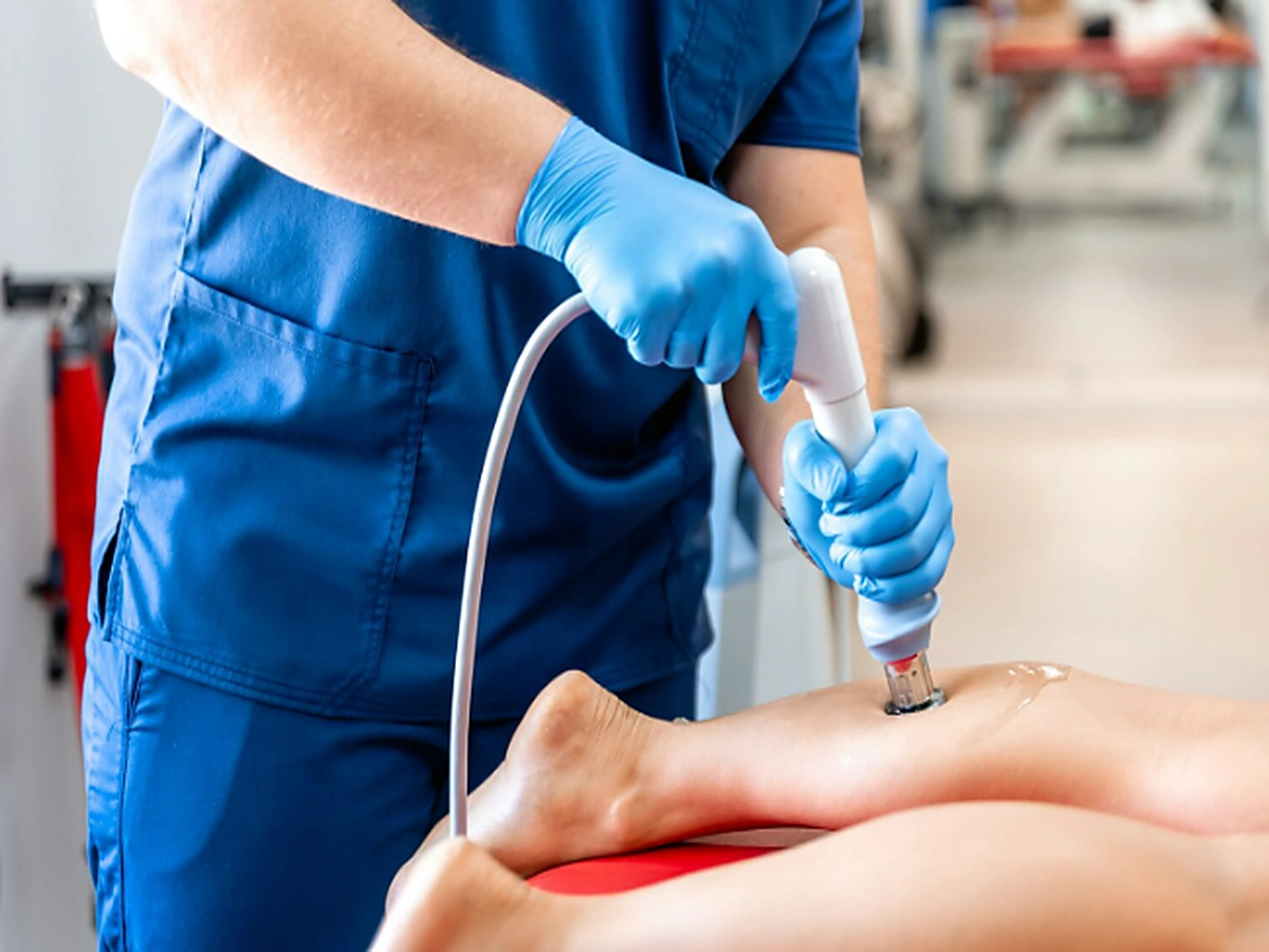 A patient discussing pain with a clinician